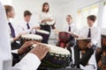 Teenage Students Studying Percussion In Music Class