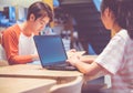 Teenage students studying together use laptop computer for e-learning at library,Education concept Royalty Free Stock Photo