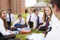 Teenage Students In Uniform Working On Project Outdoors Royalty Free Stock Photo