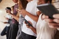 Teenage Students Using Digital Devices On College Campus