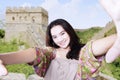 Teenage takes selfie picture at great wall Royalty Free Stock Photo