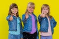 Teenage three girls raises thumbs up agrees, gives positive reply, like gesture, good feedback