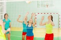 Teenage volleyball team receiving the ball Royalty Free Stock Photo