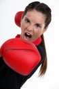 Teenage woman boxing.