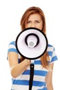 Teenage woman screaming through megaphone Royalty Free Stock Photo