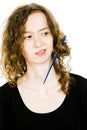 Teenaged blond girl with hair having tangled hair dressing problem - jammed comb Royalty Free Stock Photo