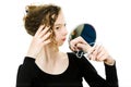 Teenaged girl checking look in mirror her curly blond hairs - to be perfect Royalty Free Stock Photo