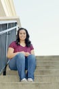 Teen Girl Sitting on Stairway Royalty Free Stock Photo