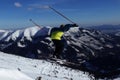 Teenager as professional skier was captured in big jump on fresh powder snow in Low Tatras in Slovakia. Ski rider is trying to