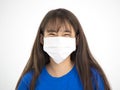 Teenager Asian girl smiling and wearing medical mask