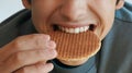 Teenager biting belgian waffle