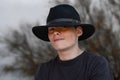 Teenager with black hat Royalty Free Stock Photo