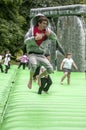 Teenager bouncing on an inflatable Stonehenge