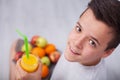 Teenager boy with all the right diet choices - holding fruit plate and fresh juice Royalty Free Stock Photo