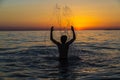 Teenager boy bathing in the sea at sunset in Sicily Royalty Free Stock Photo