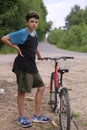 Teenager boy with bicycle Royalty Free Stock Photo