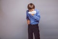 Teenager boy blowing his nose brown hair of Royalty Free Stock Photo