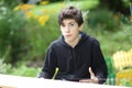 Teenager boy carpenter measure wood board to make housekeeping work Royalty Free Stock Photo