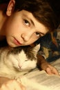 Teenager boy with cat reading book Royalty Free Stock Photo