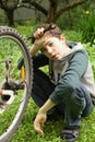 Teenager boy change bicycle tire weel camera Royalty Free Stock Photo