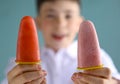 Teenager boy happy portrait with juicy frozen home made ice cream