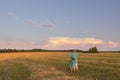 Teenager boy looking on beautiful cloudscape Royalty Free Stock Photo