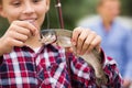 Teenager boy looking at fish on hook Royalty Free Stock Photo