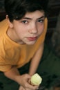 Teenager boy with pistachio icecream cone Royalty Free Stock Photo