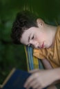 Teenager boy reading in hammock Royalty Free Stock Photo