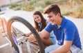 Teenager boy repair tire on bicycle Royalty Free Stock Photo