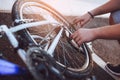 Teenager boy repair tire on bicycle Royalty Free Stock Photo