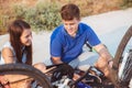 Teenager boy repair tire on bicycle Royalty Free Stock Photo