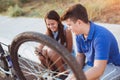 Teenager boy repair tire on bicycle Royalty Free Stock Photo