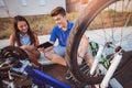 Teenager boy repair tire on bicycle Royalty Free Stock Photo