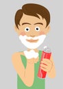 Teenager boy shaving showing foam holding foamy regular shave cream Royalty Free Stock Photo