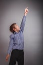 Teenager boy shows hand up laughing Royalty Free Stock Photo