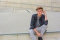 Teenager boy sitting on stairs thinking