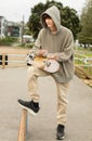 Teenager boy in a skate park, outdoor portrait. adolesence concept, teen culture Royalty Free Stock Photo