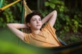 Teenager boy reading in hammock Royalty Free Stock Photo