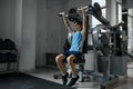 Teenager Boy Training Arms, Chest, Shoulders And Back On Exercise Machine