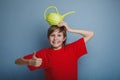 Teenager boy twelve years in red shirt holding Royalty Free Stock Photo