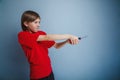 Teenager boy twelve years in the red t-shirt with Royalty Free Stock Photo