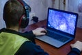 Teen plays computer games, The boy sits at home computer. Reading, boys Royalty Free Stock Photo