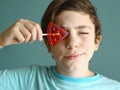 Teenager boy with water melon shape sugar candy on stick Royalty Free Stock Photo