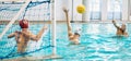 Teenager, boys and team, water polo and playing game with sports, action and energy in indoor swimming pool. Young male Royalty Free Stock Photo