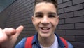 Teenager bullying, mucking about into camera, social condemnation, victim POV