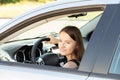 Teenager in car,student driver in a driving school at a driving lesson behind the wheel of a car,girl gets a driver`s license
