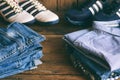 Teenager casual outfit. Boys shoes, clothing and accessories on wooden background - sweater, shirt, trousers, jeans, sneakers. Top Royalty Free Stock Photo