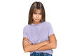 Teenager caucasian girl wearing casual clothes skeptic and nervous, disapproving expression on face with crossed arms