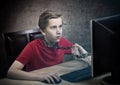 Teenager chained to his computer. Royalty Free Stock Photo